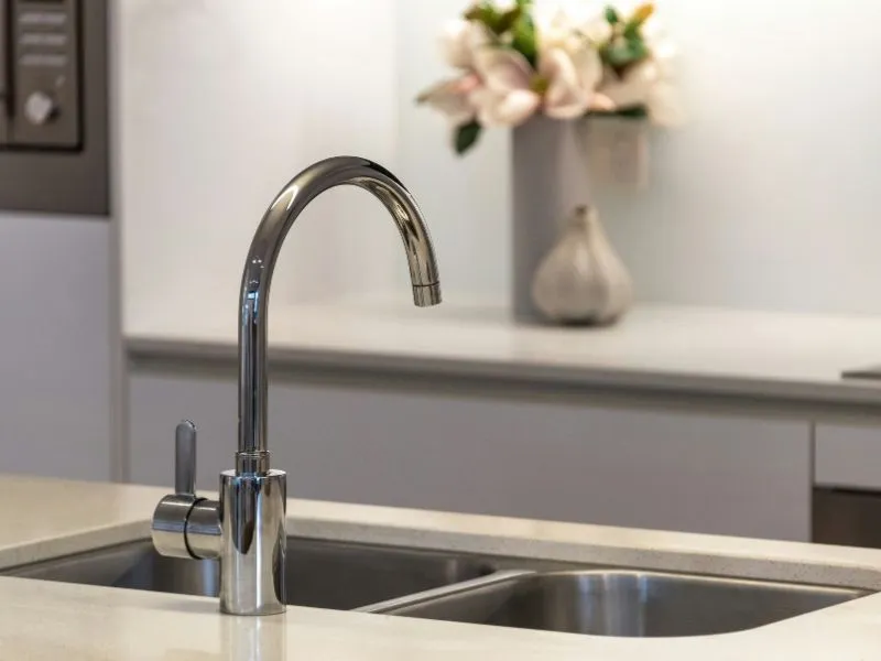 Modern double-bowl stainless steel kitchen sink and chrome faucet