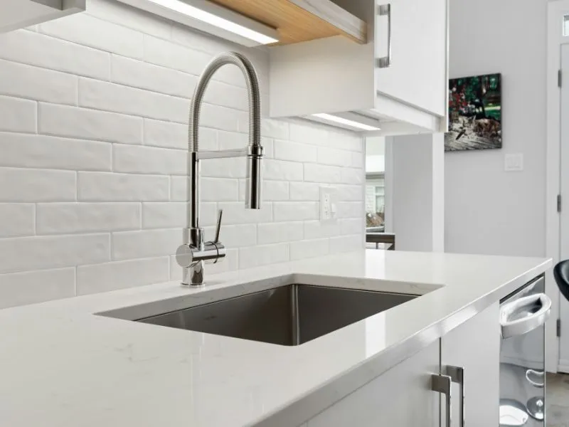 Sleek single-bowl undermount sink with a modern faucet