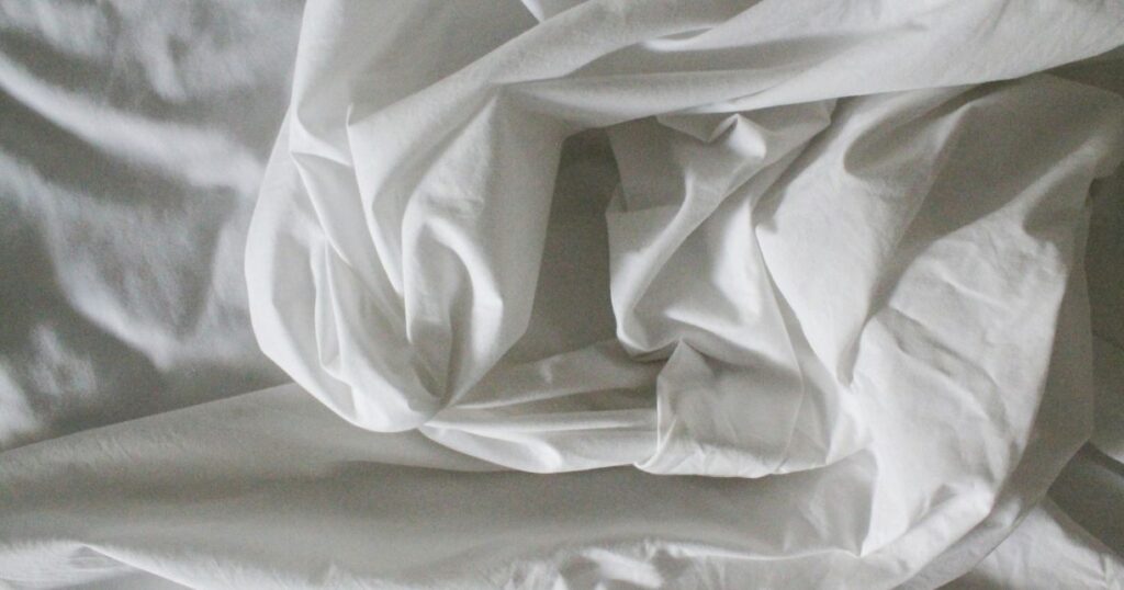 white bed sheet