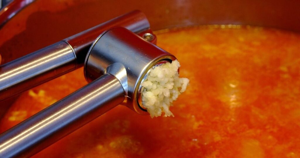 Garlic Press with pressed garlic